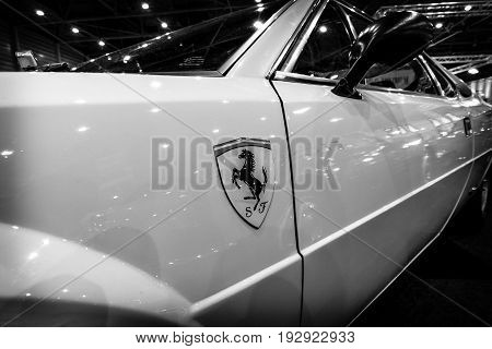 MAASTRICHT NETHERLANDS - JANUARY 14 2016: Fragment of a sports car Ferrari 308 GT4 Dino 1977. Black and white. International Exhibition InterClassics & Topmobiel 2016