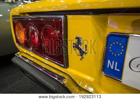 MAASTRICHT NETHERLANDS - JANUARY 14 2016: The rear brake lights of a sports car Ferrari 308 GT4 Dino 1977. International Exhibition InterClassics & Topmobiel 2016