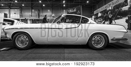 MAASTRICHT NETHERLANDS - JANUARY 14 2016: Sports car Volvo P1800 1964. Black and white. International Exhibition InterClassics & Topmobiel 2016