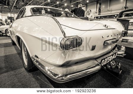 MAASTRICHT NETHERLANDS - JANUARY 14 2016: Sports car Volvo P1800 1964. Sepia. Rear view. International Exhibition InterClassics & Topmobiel 2016