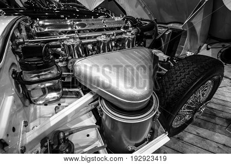 MAASTRICHT NETHERLANDS - JANUARY 14 2016: Engine compartment Jaguar E-Type Series 1 coupe 1963. Black and white. International Exhibition InterClassics & Topmobiel 2016