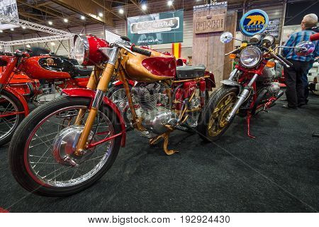MAASTRICHT NETHERLANDS - JANUARY 14 2016: Retro motorcycles Ducati 175 (foreground) and the Moto Guzzi (background). International Exhibition InterClassics & Topmobiel 2016