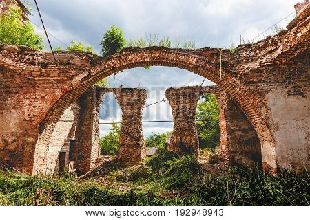 Ruins of an ancient destroyed abandoned Orthodox temple or church of red brick with big Arches in Yeletz, Lipeck region, Russia