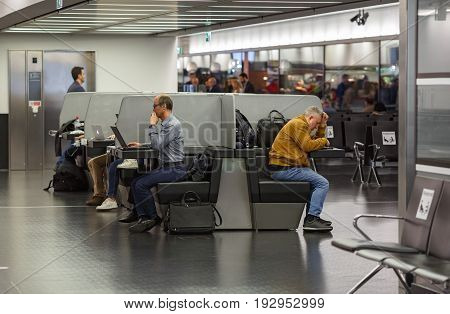 VIENNA/ AUSTRIA - APRIL 6, 2017. People working at laptops in the free Wi-Fi area of the airport Schwechat. Vienna, Austria.