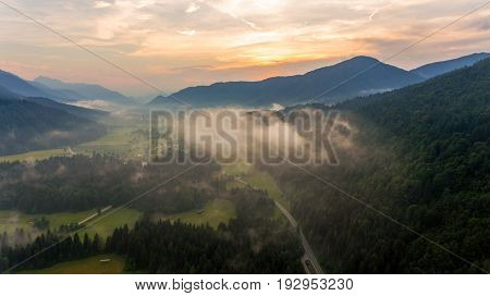 Aerial view of sunrise over a valley. Natural park Zelenci, Slovenia.