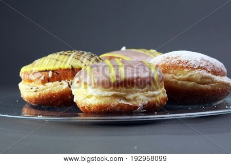 German Donuts - Berliner With Jam And Icing Sugar In A Tray On A Grey Background.