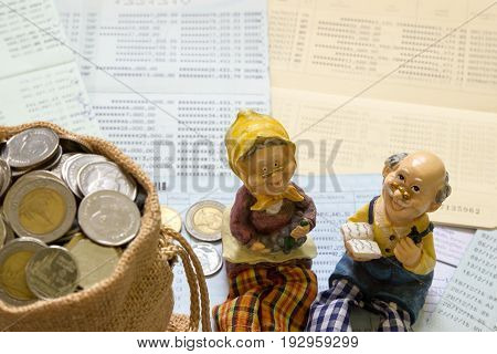Senior happy smiling couple dolls group of Thai baht coin in mini