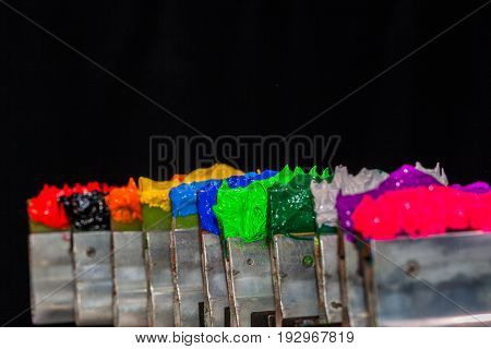ink or paint for printing on fabric there are several types. The ink used for printing on dark fabric always use plastisol ink. it useful for white fabric too