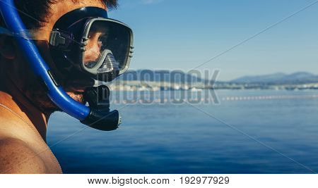 Young Man Diver With Mask For Diving And Snorkel On Background Of Sea With Space. Tourism Travel Journey Freediving Concept