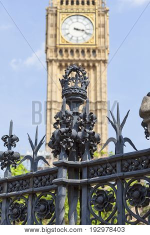 Decorative metal fence of Palace of Westminster Clock tower with Big Ben London England. The tower is officially known as Elizabeth Tower it was known as the Clock Tower.