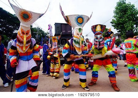 LOEI THAILAND - JUNE 25 2017 : Phi Ta Khon is a type of masked procession celebrated on the first day of a three-day Buddhist merit-making holiday known in Thai as Boon Pra Wate