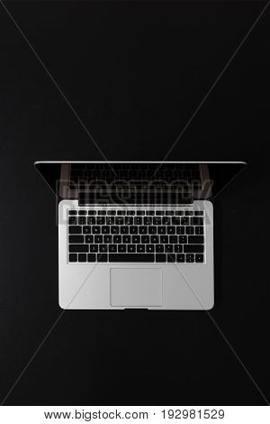 Top View Of Modern Laptop With Copy Space Isolated On Black