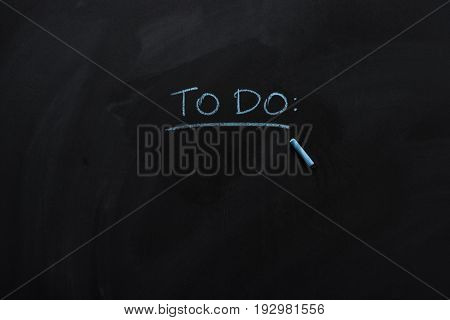 underlined to do note drawn with chalk on blackboard