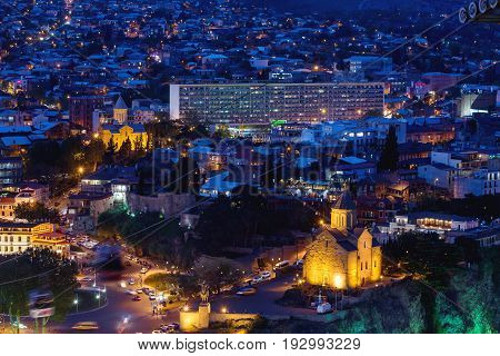 Night aerial view on Metekhi Church of the Dormition of the virgin.Monument to Vakhtang I Gorgasali. Famous landmarks in Tbilisi Georgia.