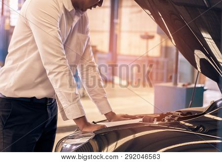 This Career Man Saleman Business Inspection Writing Note On Notepad Or Book, Paper With Car Blurry B