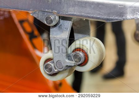 Close Up Front Wheel Of Hand Pallet For Industrial Work  Lift The Float Out Off The Ground