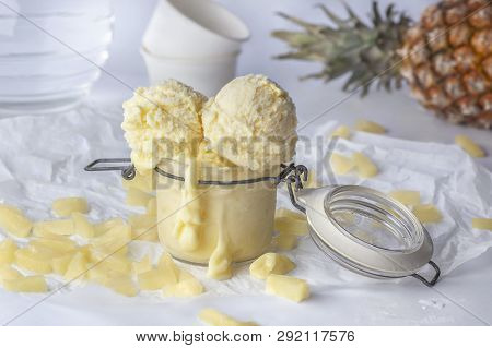 Stevia With Pineapple Ice Cream Balls Decorated With Pineapple Slices And Whole Fruit On White Backg