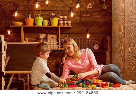 Cooperation Concept. Mother And Son Cooperate In Building Structure Model, Cooperation. Cooperation 