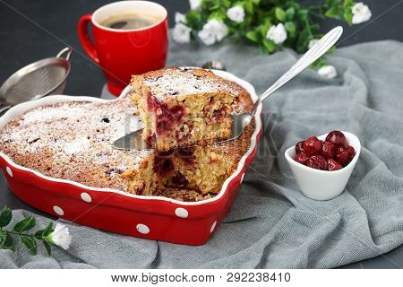 Oatmeal Pie With Cherry Dusted With Powdered Sugar In A Ceramic Form In The Shape Of A Heart