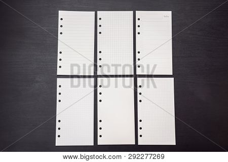 Different Paper For Notepad Mocap On A Black Wooden Background