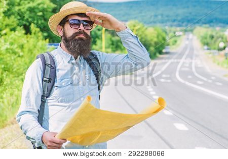 Any Transport. Traveler With Map Looking For Hitchhiking Transportation Alone At Edge Of Road. Tips 