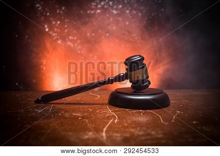 Document With Judge On Wooden Table. Law Theme. Selective Focus