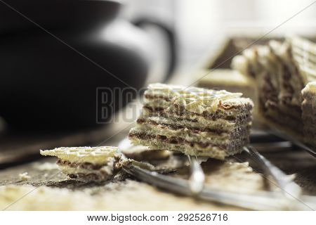Sweet Russian Artek Waffles On Wooden Background, With A Pot Of Milk. Traditional Sweets And Dessert