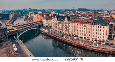 Berlin, Germany - March 06, 2017: Unidentified Ypeople Walk Along Old Fascades And Enjoy The Fresh A