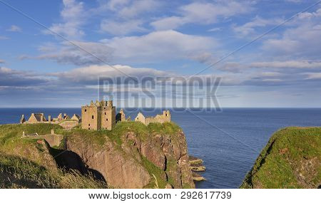 Landscape Of Dunnottar Castle Ruins Withh Dark Clouds And The Ocean