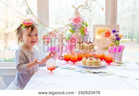 Little Toddler Girl Eating Dessert After Easter Dinner