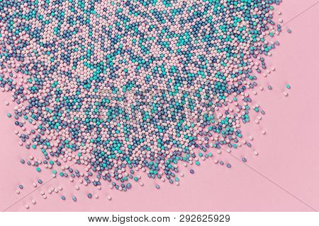 Colorful Nonpareils Cake Candy Sprinkles In Two White Rectagular Bowlsand Spoon On Pink Blue Backgro