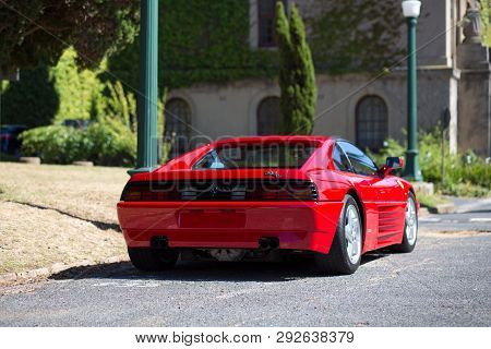 Cape Town, South Africa. 31 March 2019. A Retro Vintage Red Ferrari 348 Ts Is Parked On The Side Of 