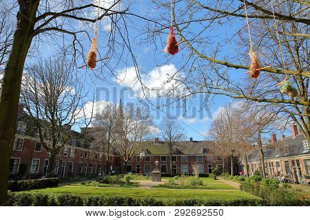 Haarlem, Netherlands - March 24, 2019: The Courtyard Provenierhuis (hofje) With Seeds For Birds In T