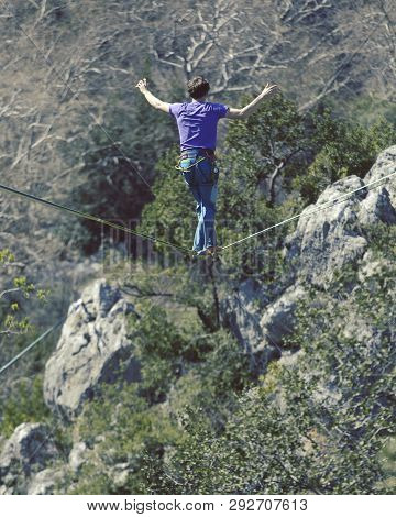 Man Balancing On The Rope Concept Of Risk Taking And Challenge.