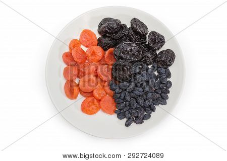 Top View Of Different Traditional Dried Fruits - Dark-colored Raisins, Dried Prunes And Dried Aprico