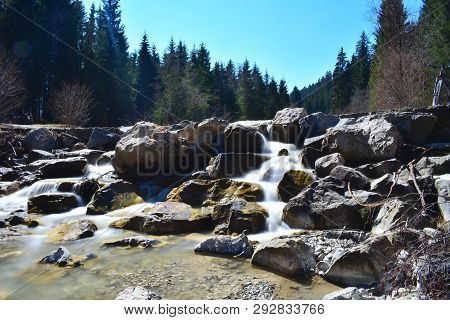 Photo Of A River And A Waterfall In The Bavarian Alps.