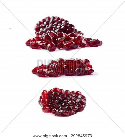 Pomegranate Seeds Isolated On White Background. Ripe Pomegranates Close-up. Sweet And Juicy Garnet W