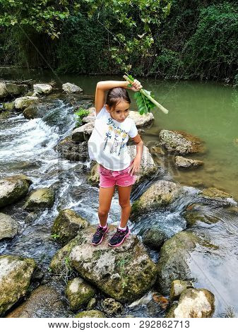 Smiling Girl Posing On The River Palancia As It Passes Through Segorbe