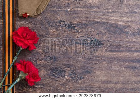 St. George Ribbon And Red Carnation, May 9 Victory Day Concept, Symbol Of The Second World War, Dark