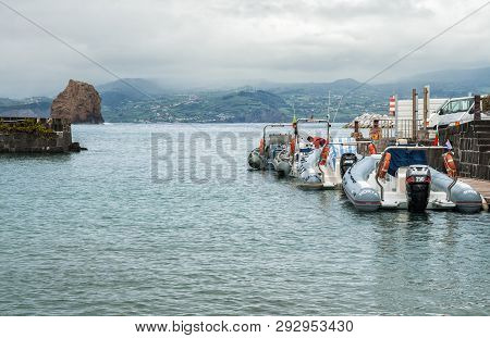 Madalena, Portugal - May 03, 2012: Inflatable Motor Boats Moored At The Pier Of The City Of Madalena
