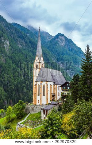 Gothic church of St. Vincenzo. The beginning of the famous road Grossglocknerstrasse. The most beaut ecological, historical, iful village in the Alps is Heiligenblut. Spring in the Austrian Alps. 