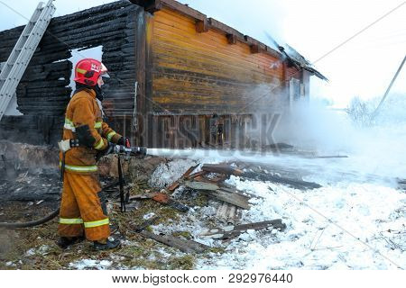 Rescuers Put Out A Burning House In The Village. Belarus/oshmyany/18 December 2018