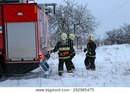 Rescuers put out a burning house in the village. Belarus/Oshmyany/18 December 2018