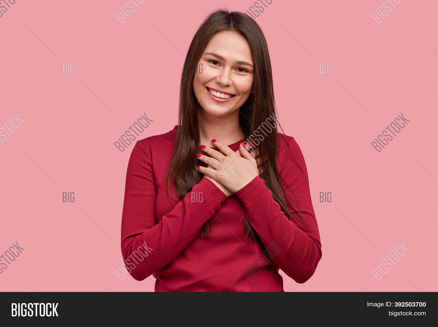 Quiet and confident stock photo. Приподняла волосы руками. Pleased with her. Женщина подымает рубашку чтобы показать фото. Потерев руки.