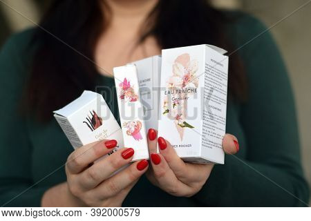 Young Girl Holds Yves Rocher Production In Packages. Yves Rocher Is A Worldwide Cosmetics And Beauty