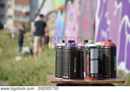 Used Montana Black And Hardcore Aerosol Spray Cans Against Graffiti Paintings. Mtn Or Montana-cans I