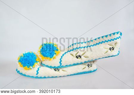 Greek Wool Slippers With Pumpons On A Light Background