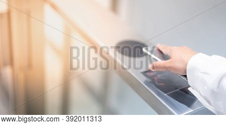 The Female Hand Contactless Pays For The Public Transport In The Subway, Payment By Smartphone Or Pu