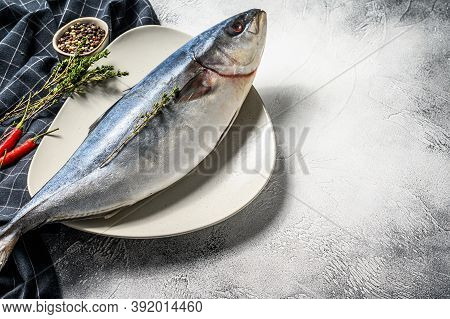 One Piece Of Japanese Amberjack. Raw Fish Yellowtail. Gray Background. Top View. Copy Space
