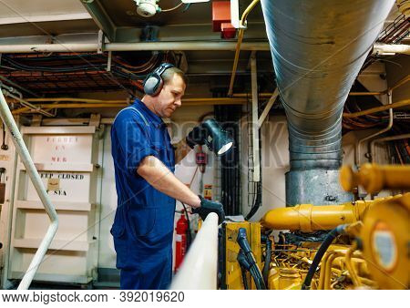 Marine Engineer Officer Controlling Vessel Enginesand Propulsion In Engine Control Room Ecr